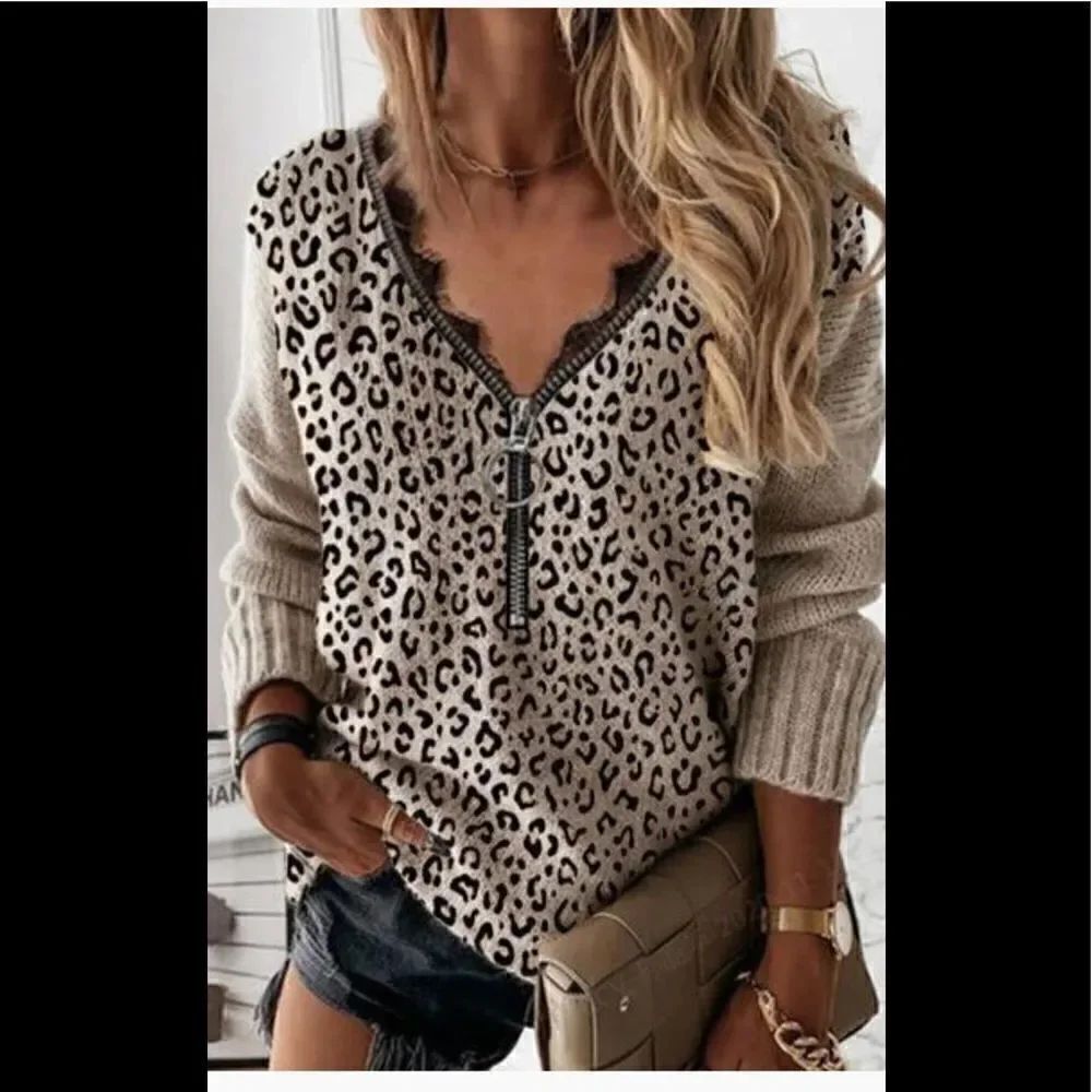 V-neck long sleeve animal print top with zipper and lace trim. Large -XL